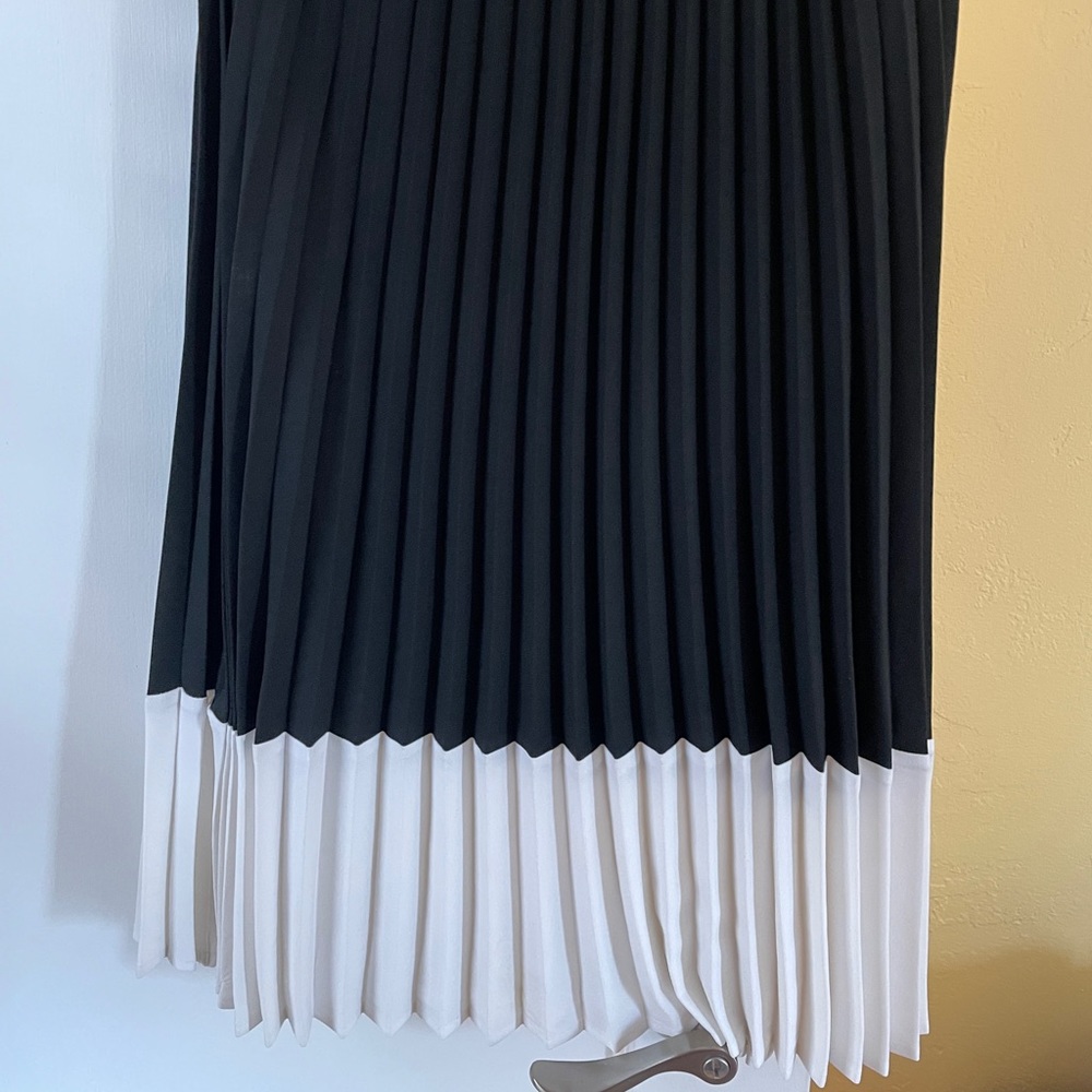 Pleated black and white midi skirt